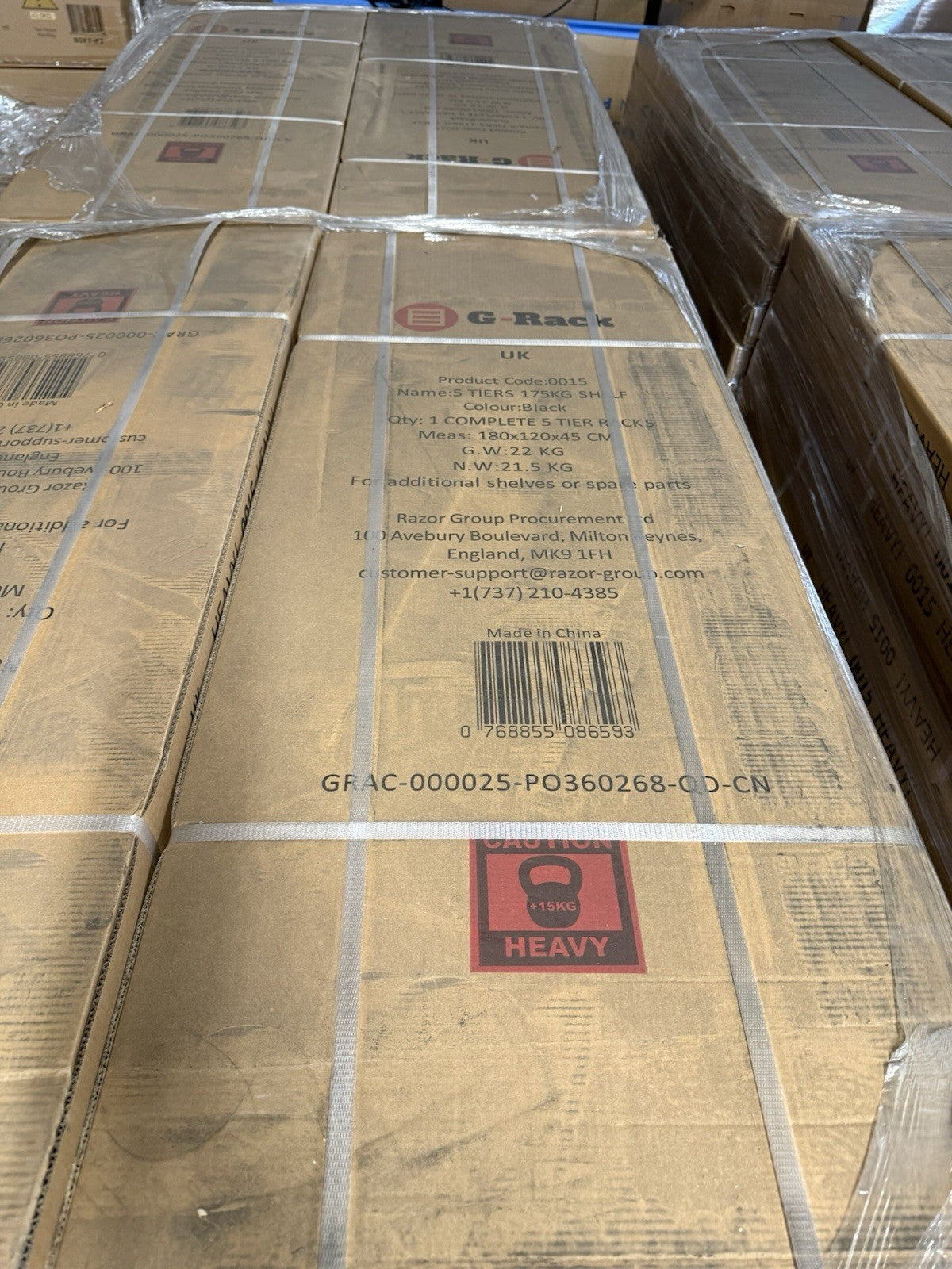 Stacked boxes of G-Rack Garage Shelving Racking ready for assembly in storage warehouse