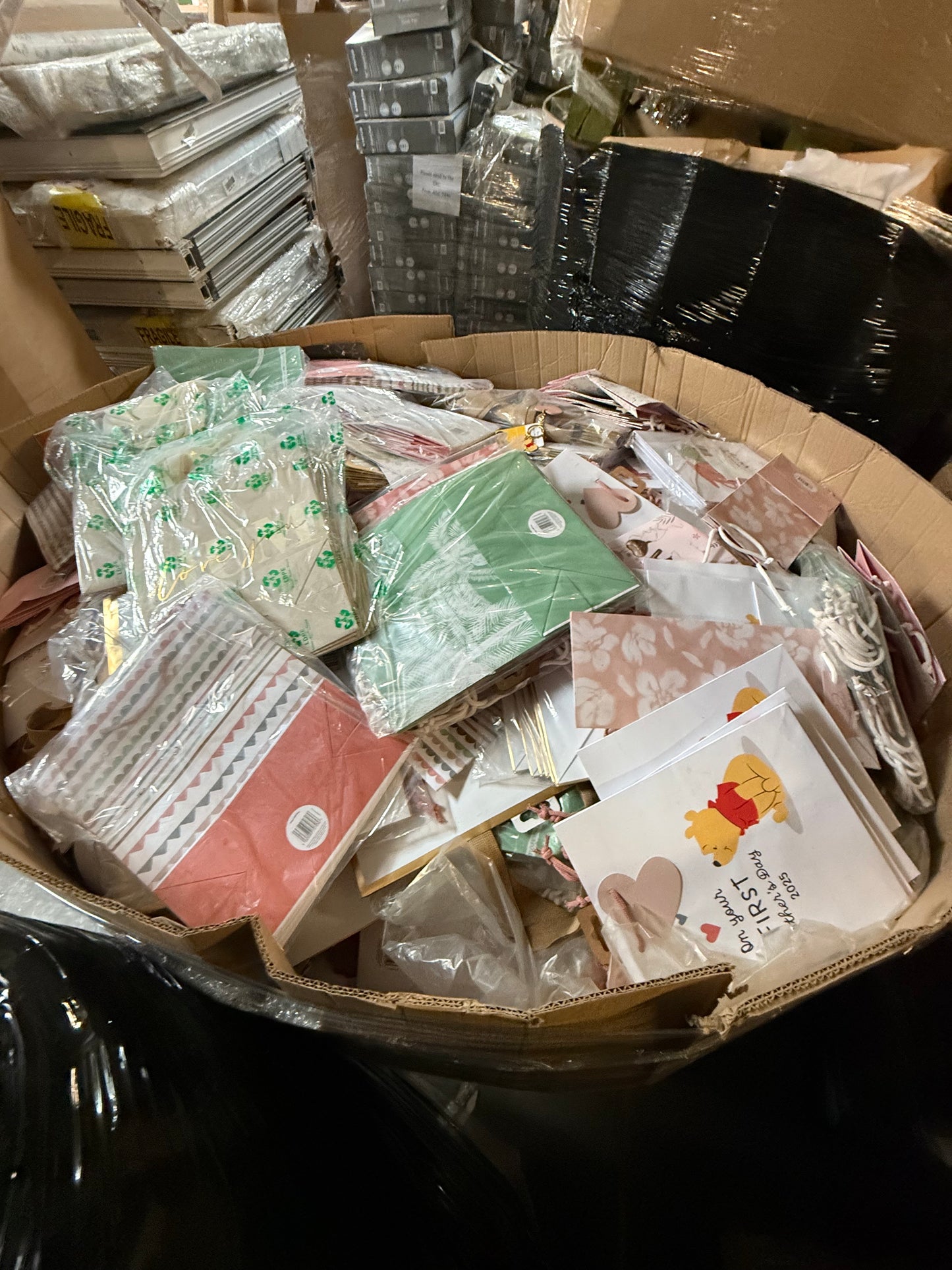 Assorted seasonal gift bags overstock in a large container for retail or personal use