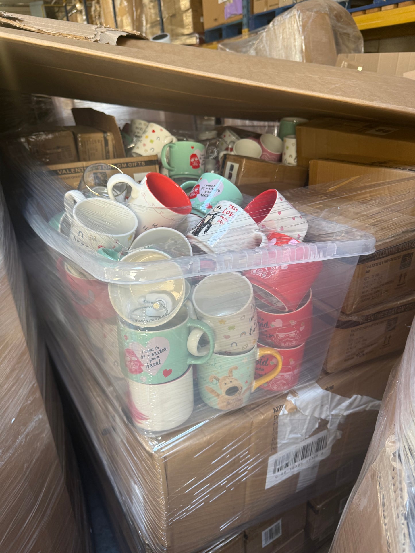 Seasonal mugs wholesale pallet stacked with colorful mugs for various celebrations and occasions