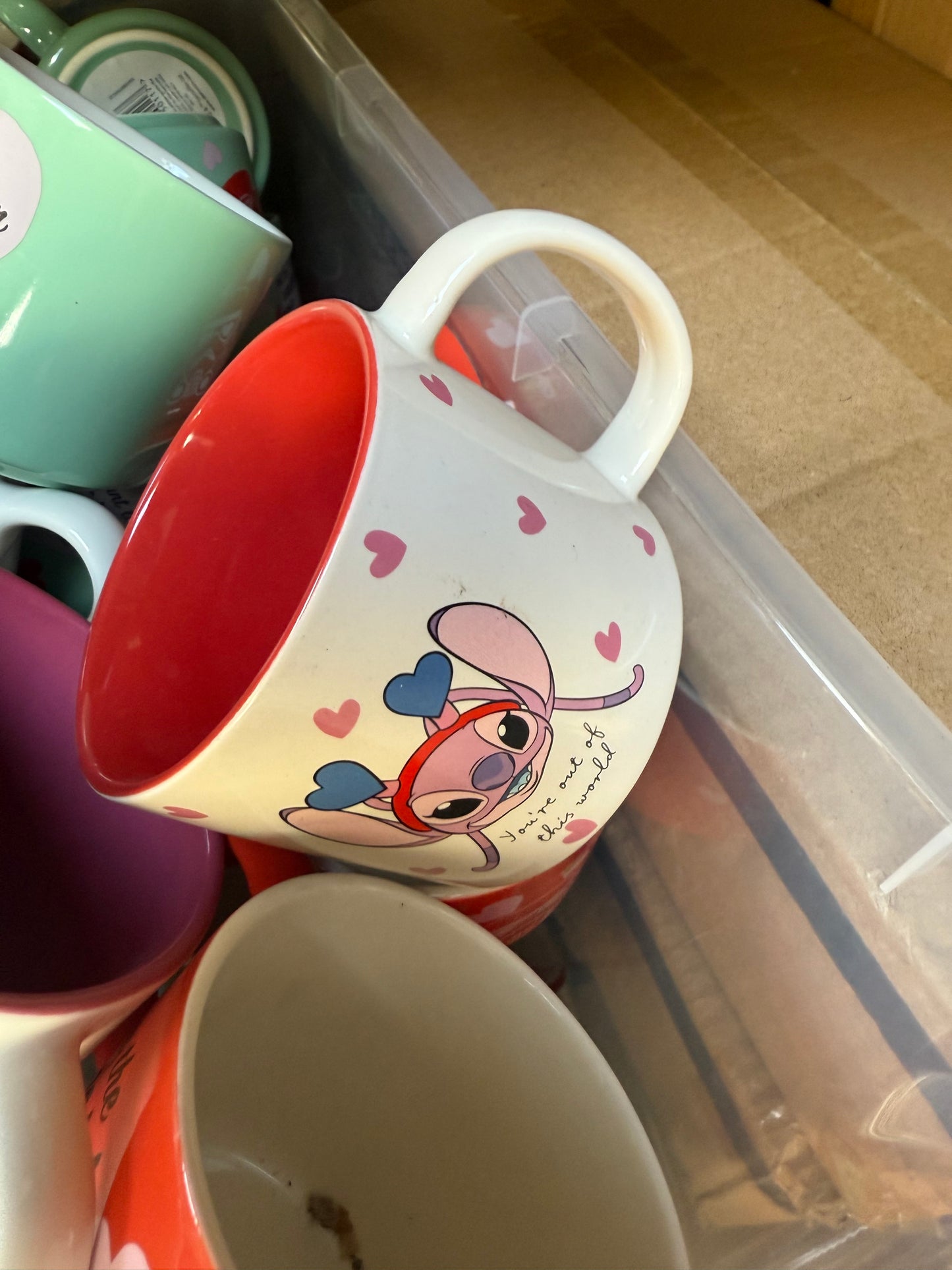 Colorful seasonal mugs wholesale pallet featuring various designs and vibrant colors