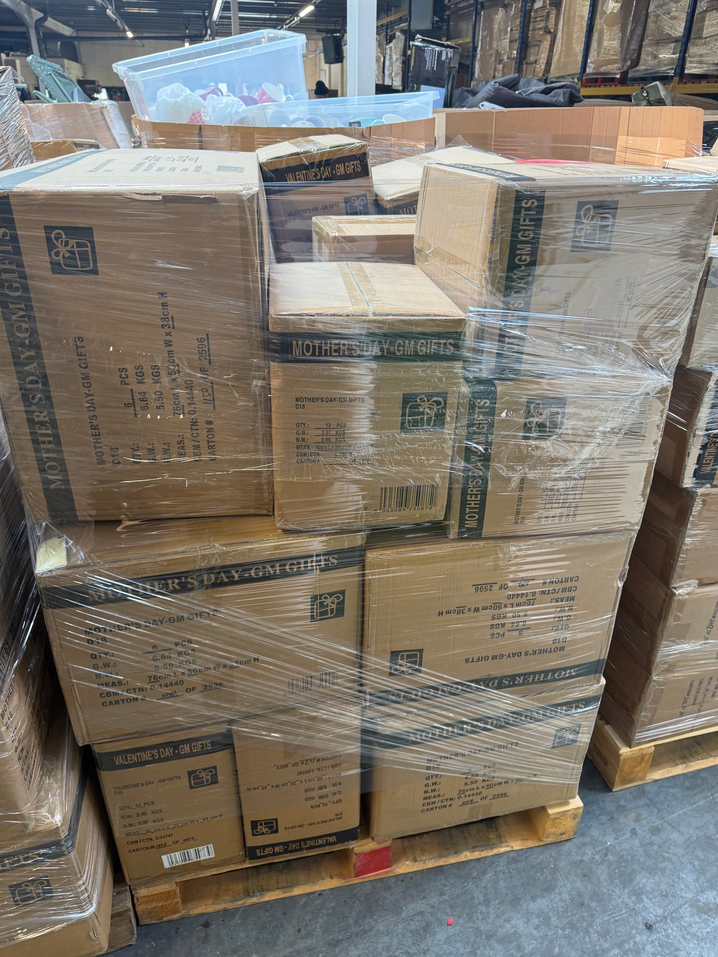 Seasonal soft toys bulk pallet stacked with cardboard boxes wrapped securely for shipment