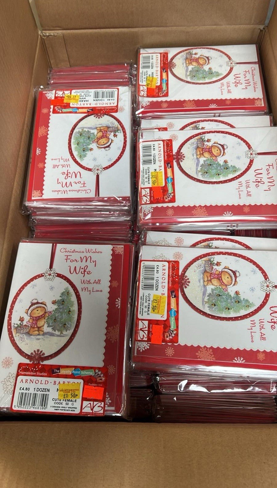 Box of Christmas cards with red envelopes and festive bear design by Ironbridge and Sons Ltd bulk greeting cards wholesale