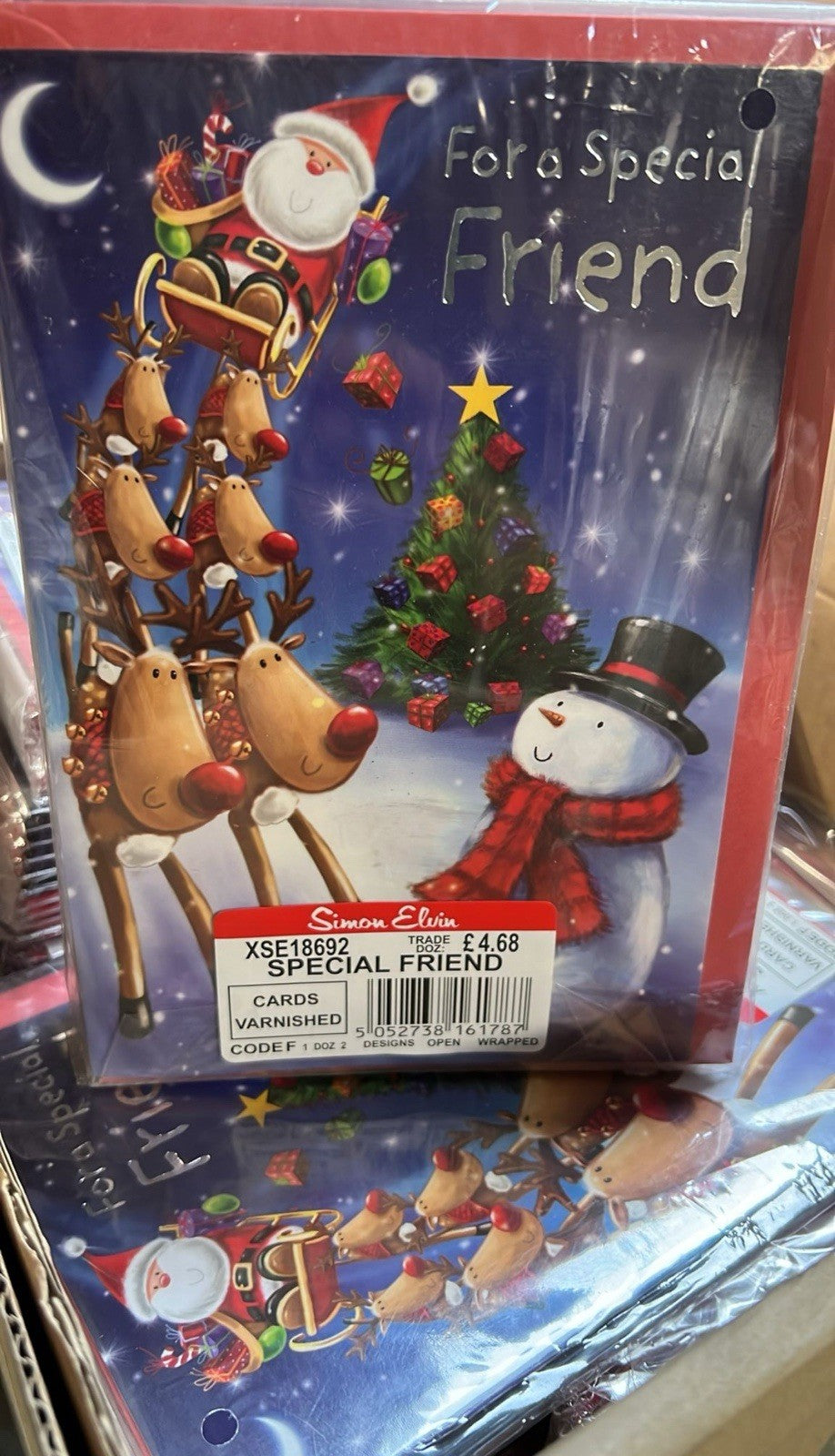 Christmas card showing Santa sleigh and reindeer with snowman and tree reading For a Special Friend bulk greeting cards wholesale