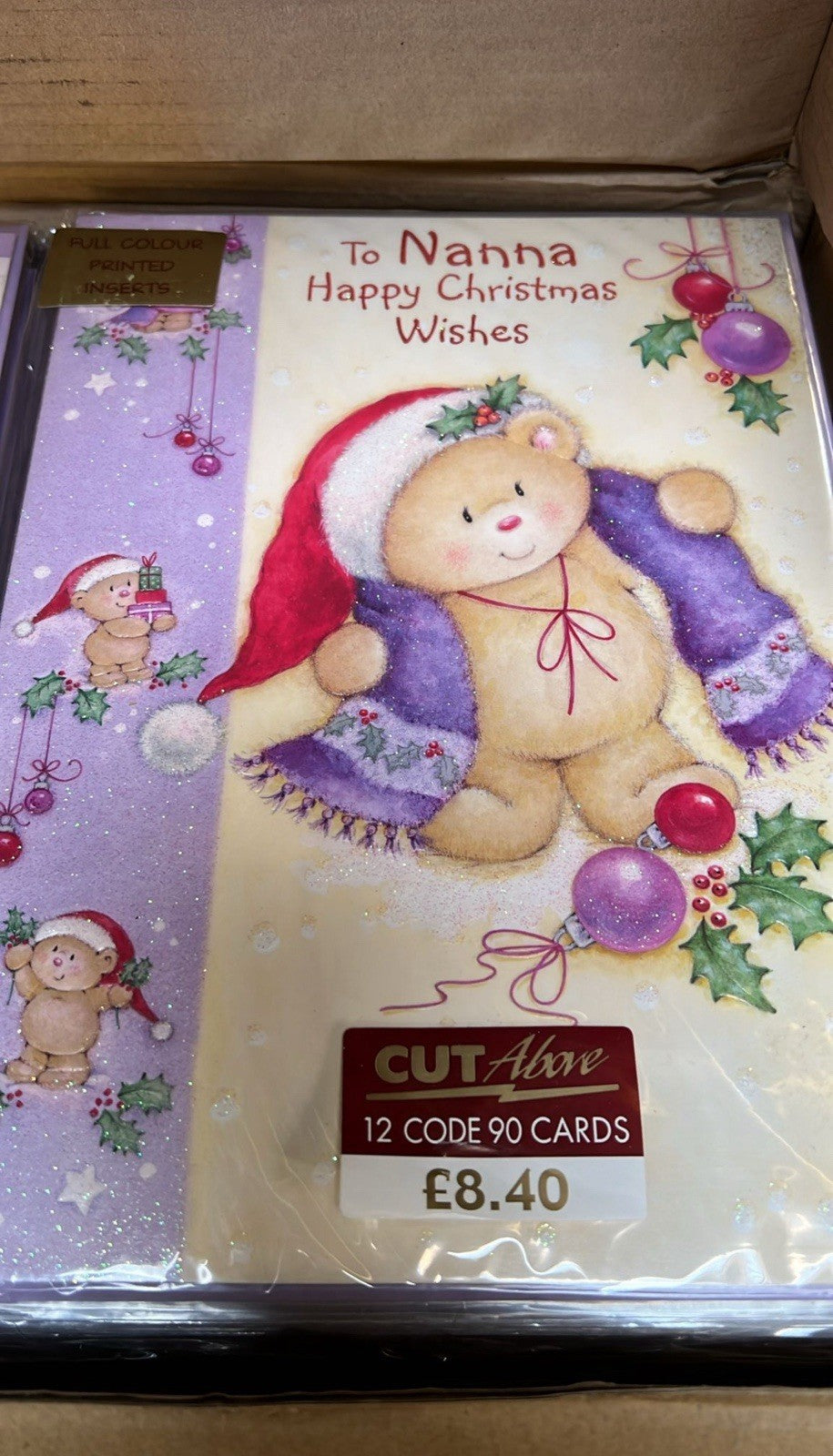 Pack of 12 Christmas cards To Nanna with teddy bear in Santa hat and holly price 8.40 GBP bulk greeting cards wholesale