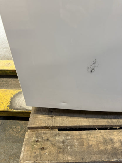 Beko CFG4582W frost free fridge freezer with a small dent on the side, displayed on a wooden pallet