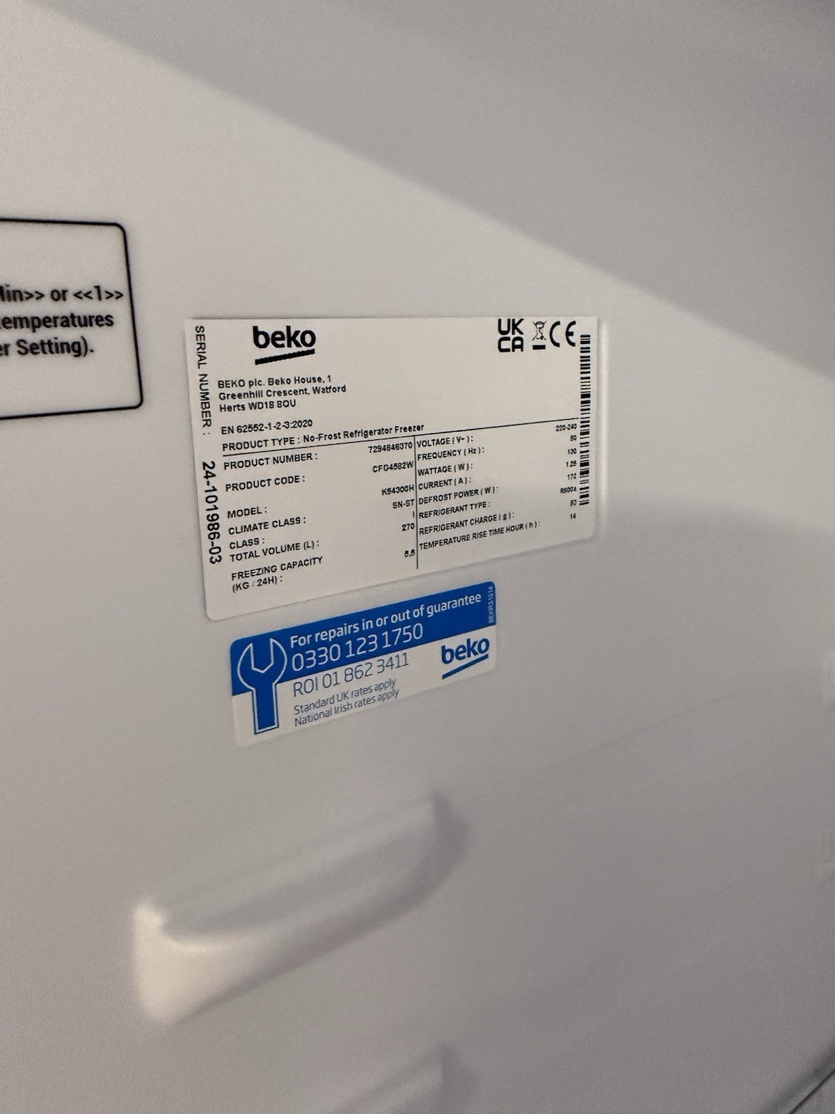 Product label for the Beko CFG4582W frost free fridge freezer detailing model and warranty information