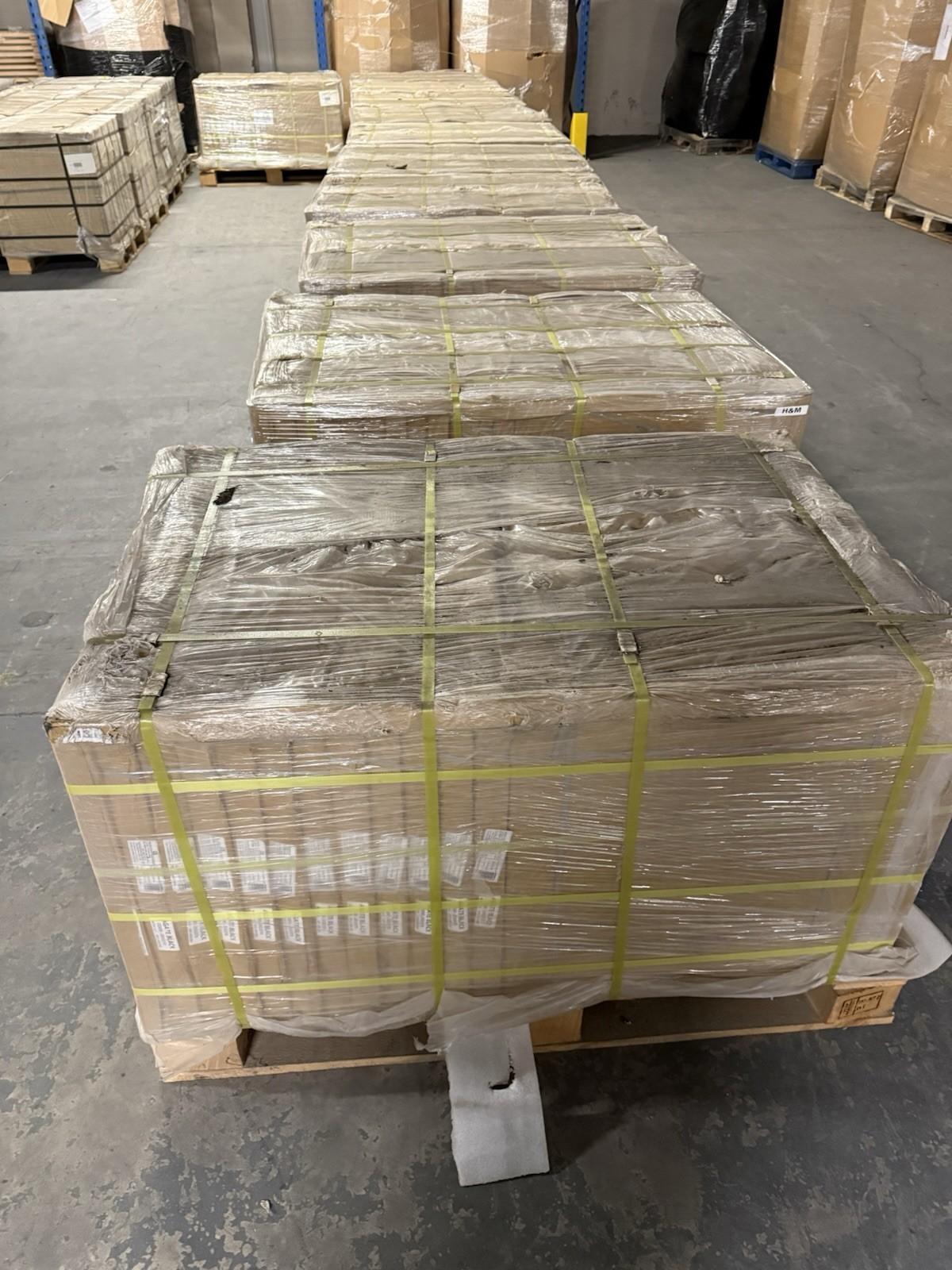 Stacked pallets of black outdoor porcelain floor tiles ready for outdoor renovation projects