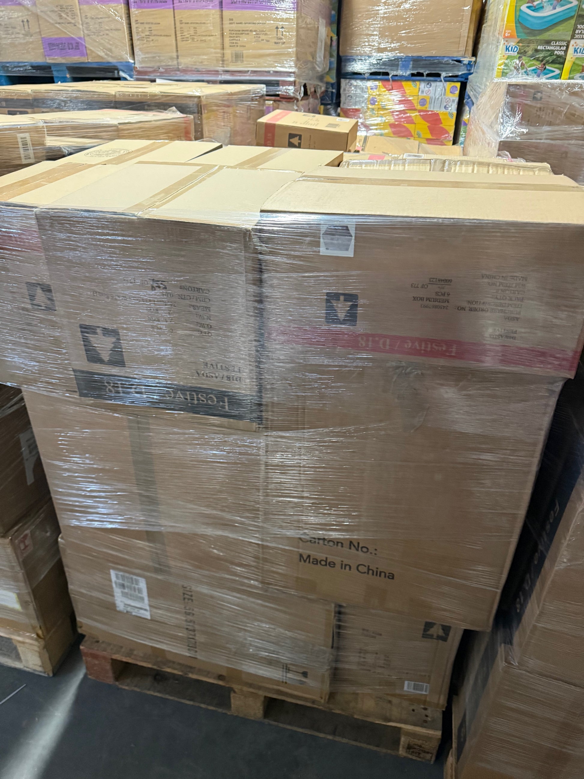 Pallets of cardboard boxes stacked neatly for Christmas Stock Wholesale Pallet by Ironbridge & Sons Ltd