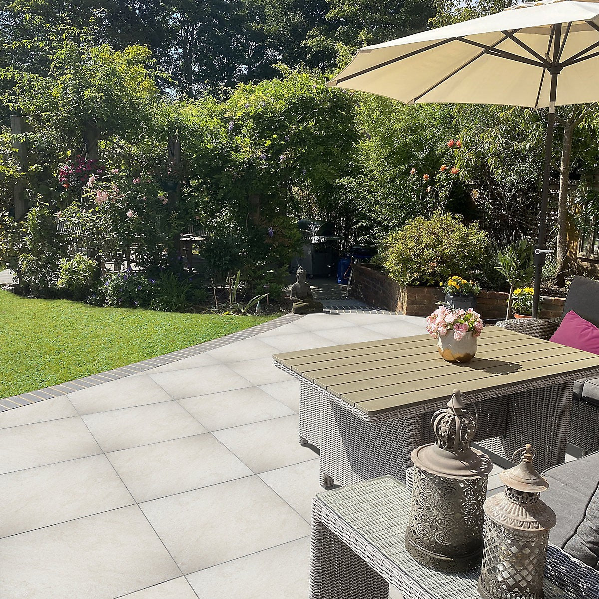 Cream Outdoor Porcelain Floor Tiles used in a garden patio setting with table and chairs