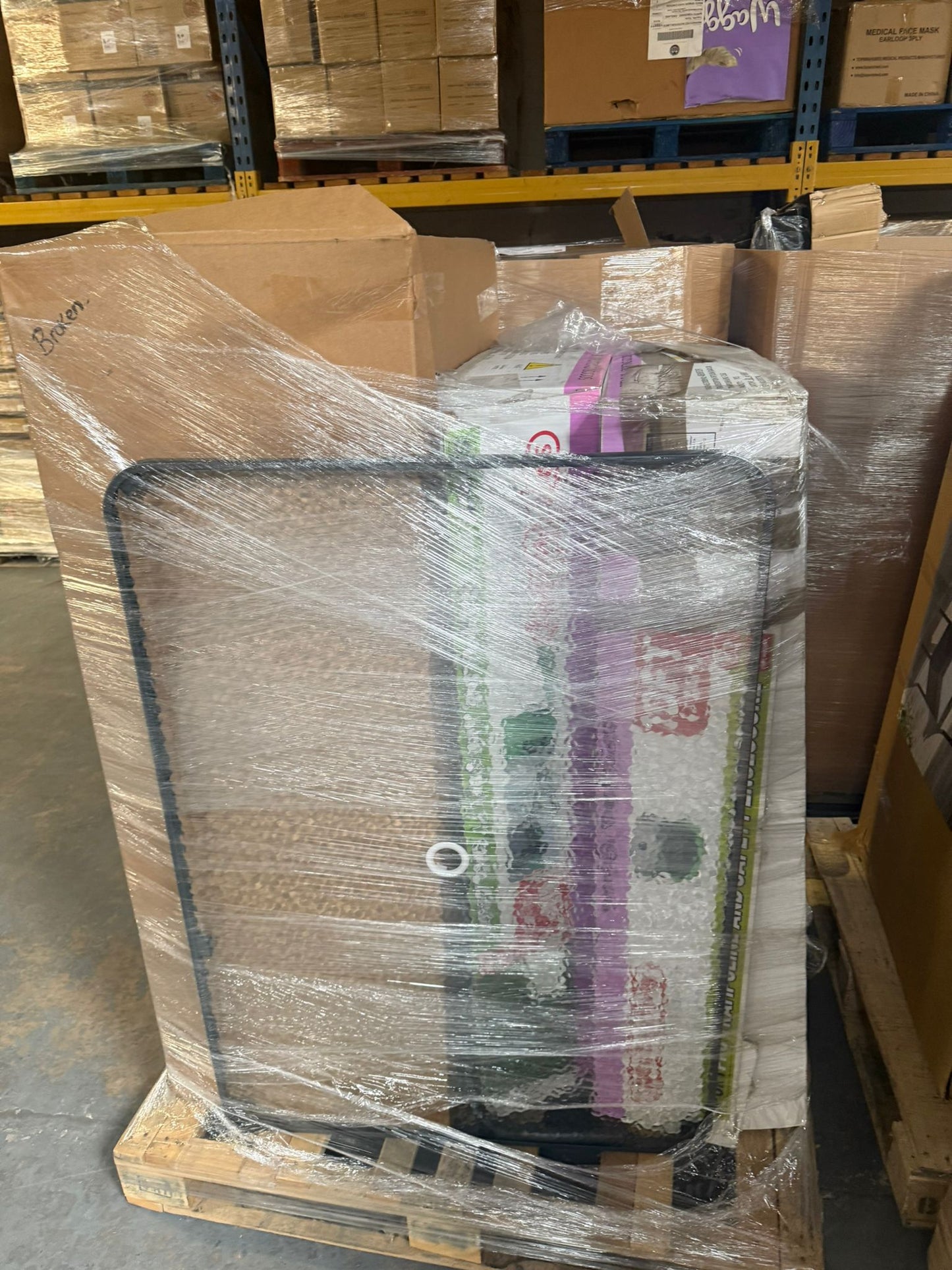 Garden products wholesale pallet featuring various packaged items ready for distribution