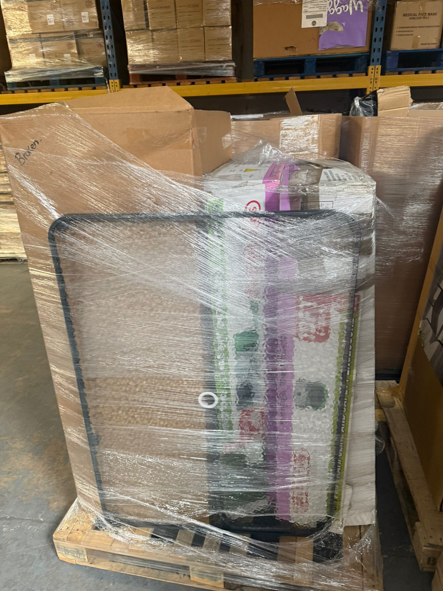 Garden products wholesale pallet featuring various packaged items ready for distribution