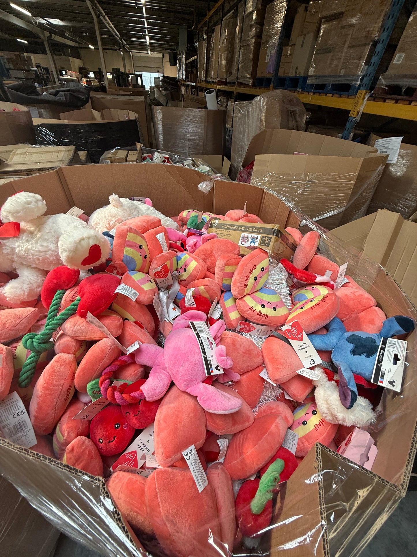 Bulk pallet of seasonal soft toys including various colorful plush items for retailers