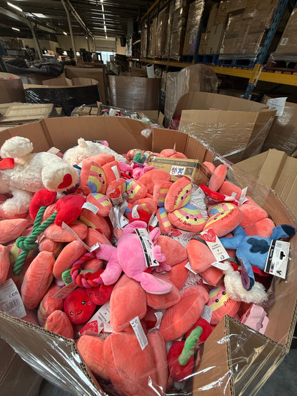 Bulk pallet of seasonal soft toys including various colorful plush items for retailers