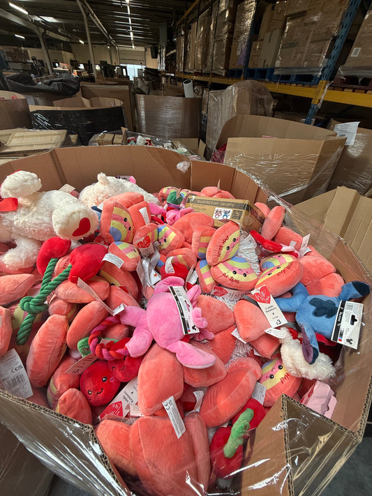 Bulk pallet of seasonal soft toys including various colorful plush items for retailers